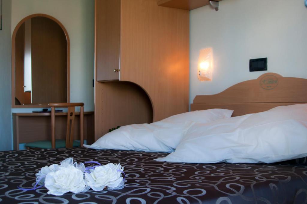 Postel nebo postele na pokoji v ubytování Hotel Hamilton