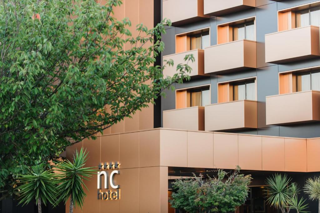 una imagen de la fachada del mg hotel en Nova Cruz Hotel, en Santa Maria da Feira