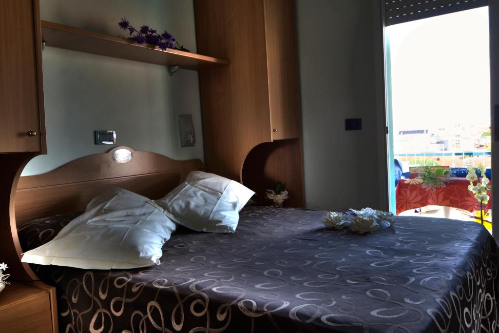 Postel nebo postele na pokoji v ubytování Hotel Hamilton