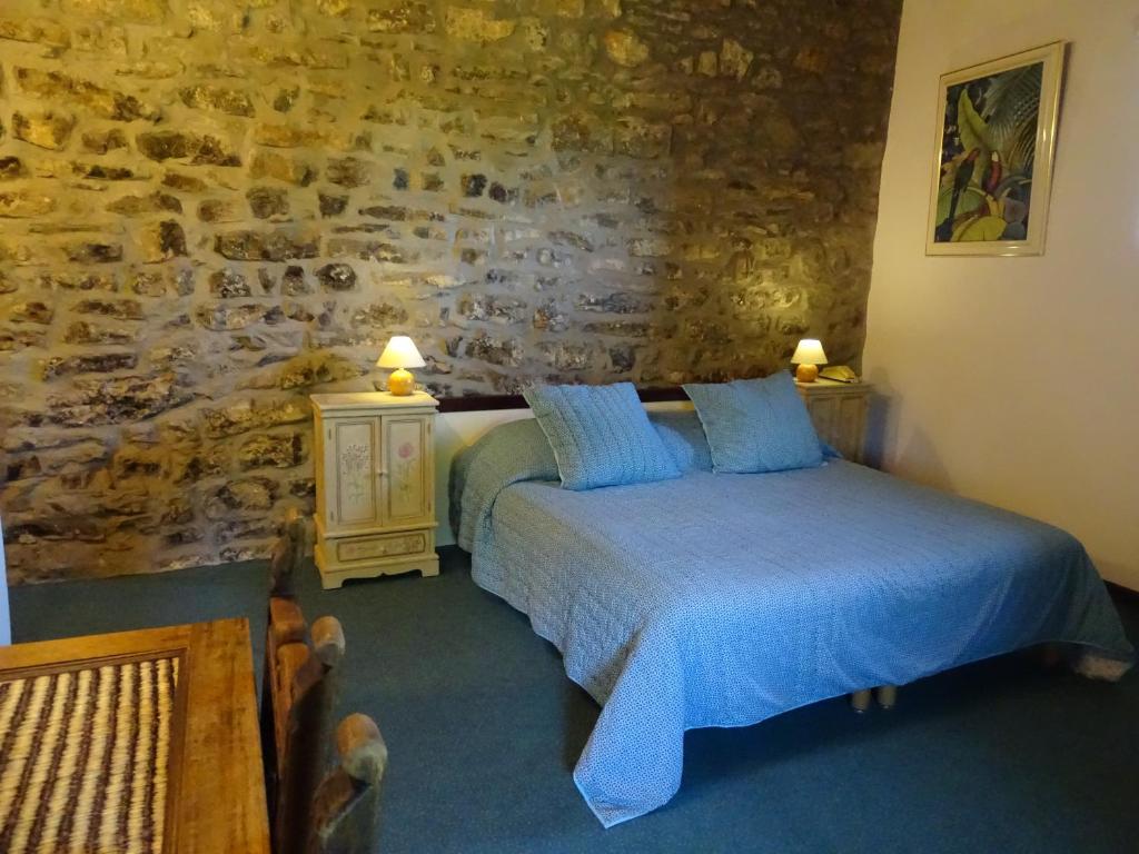 Postel nebo postele na pokoji v ubytování Hôtel Mas de l'Espaïre