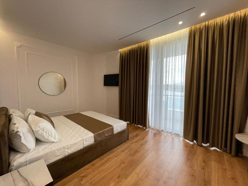 Postel nebo postele na pokoji v ubytování HOTEL UJVARA