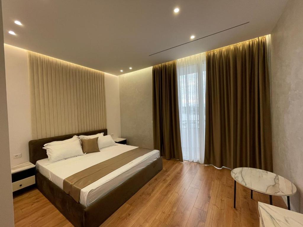 Postel nebo postele na pokoji v ubytování HOTEL UJVARA