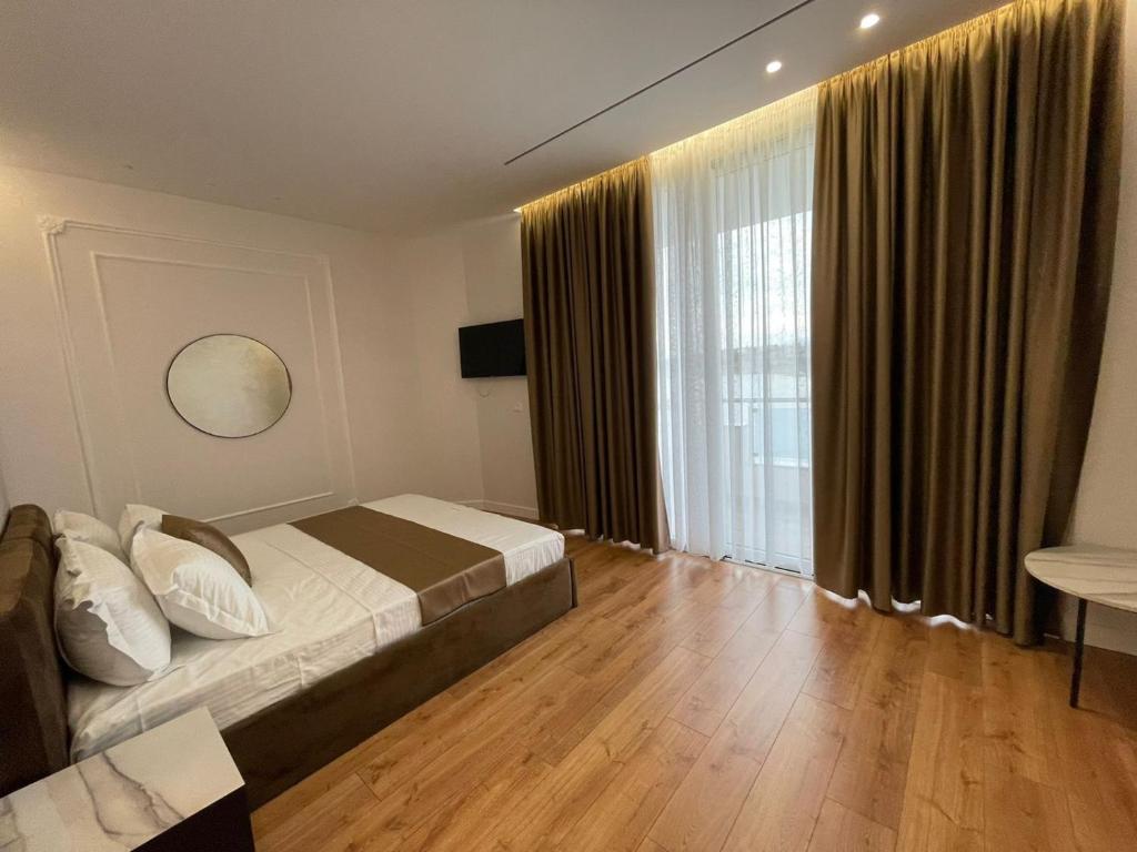 Postel nebo postele na pokoji v ubytování HOTEL UJVARA