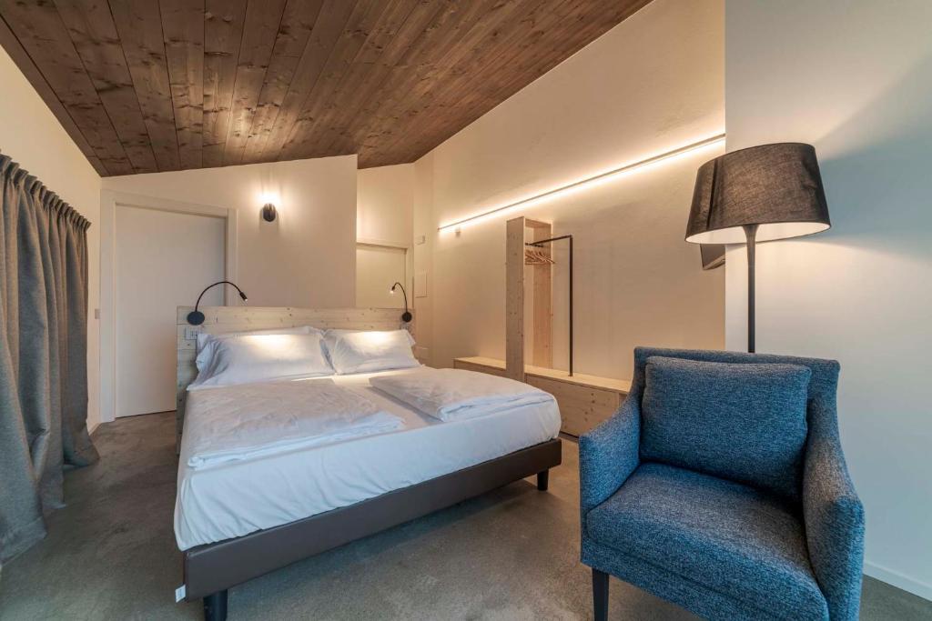 Postel nebo postele na pokoji v ubytování Agriturismo B&B Caffè e Vino