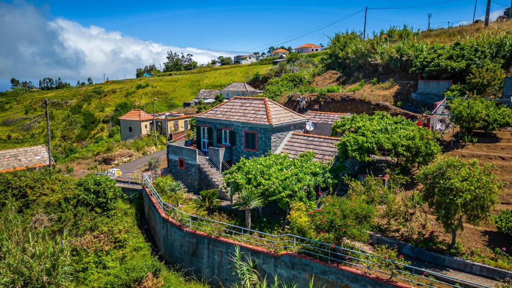 an aerial view of a house on a hill at Rainbow Cottage by Madeira Sun Travel in Ponta do Pargo