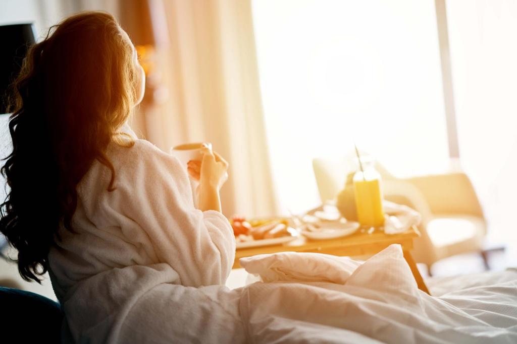 Postel nebo postele na pokoji v ubytování Hotel De Hofkamers