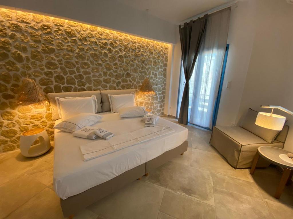 Ένα ή περισσότερα κρεβάτια σε δωμάτιο στο Kores of Poros