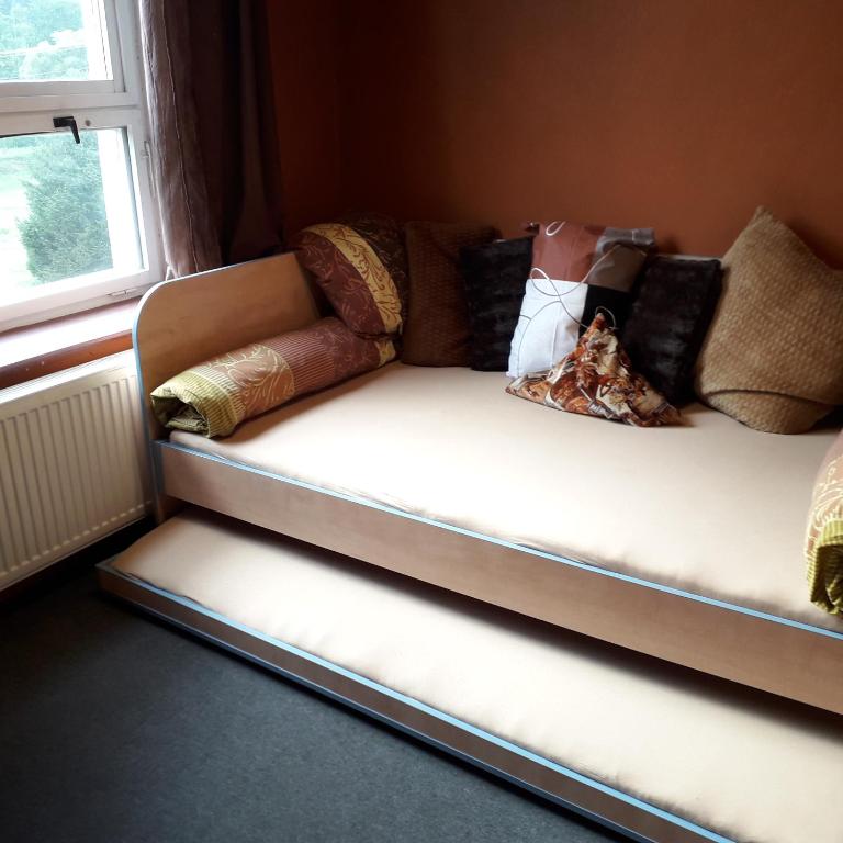 Postel nebo postele na pokoji v ubytování Doly 4