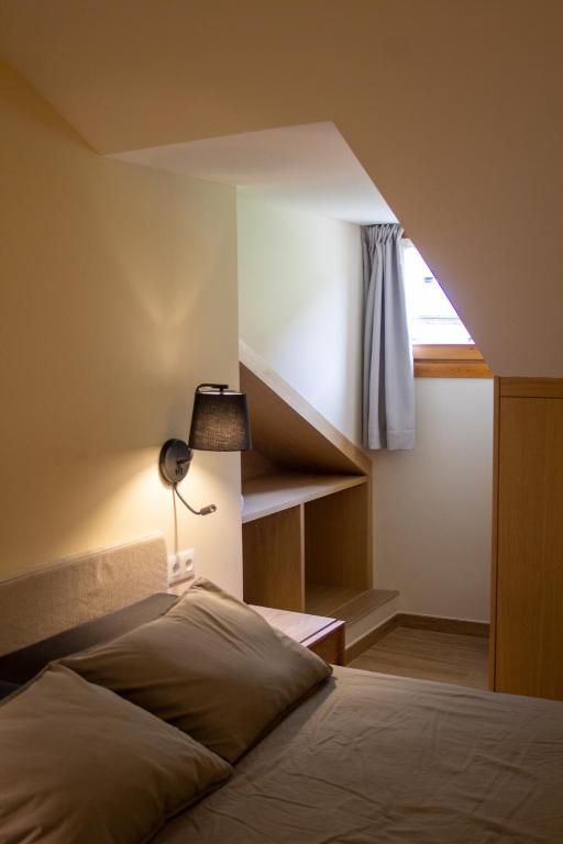 Postel nebo postele na pokoji v ubytování Apartaments Areny - L'Amfitriona