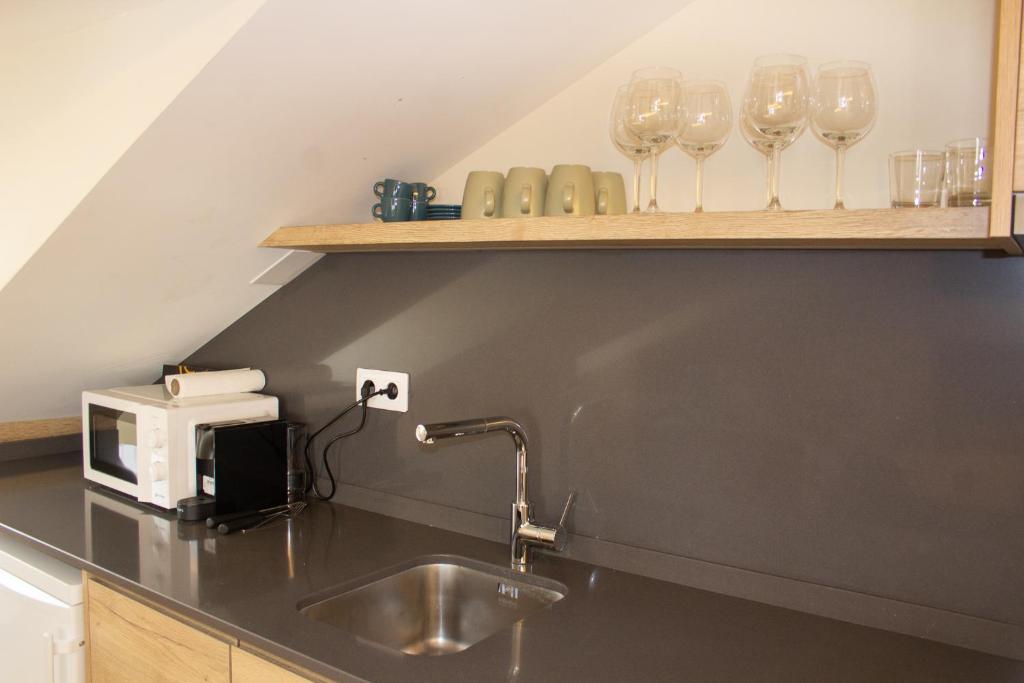 Kuchyň nebo kuchyňský kout v ubytování Apartaments Areny - L'Amfitriona