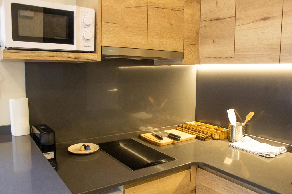 Kuchyň nebo kuchyňský kout v ubytování Apartaments Areny - L'Amfitriona