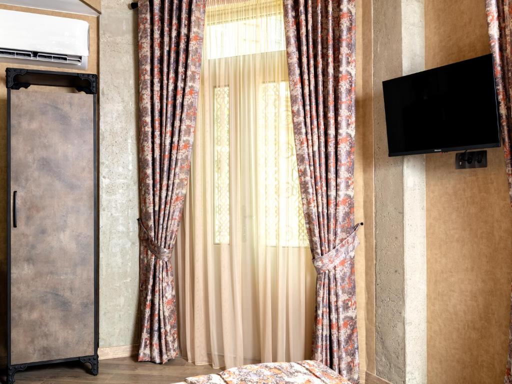 TV a/nebo společenská místnost v ubytování 6 Unique Apartments
