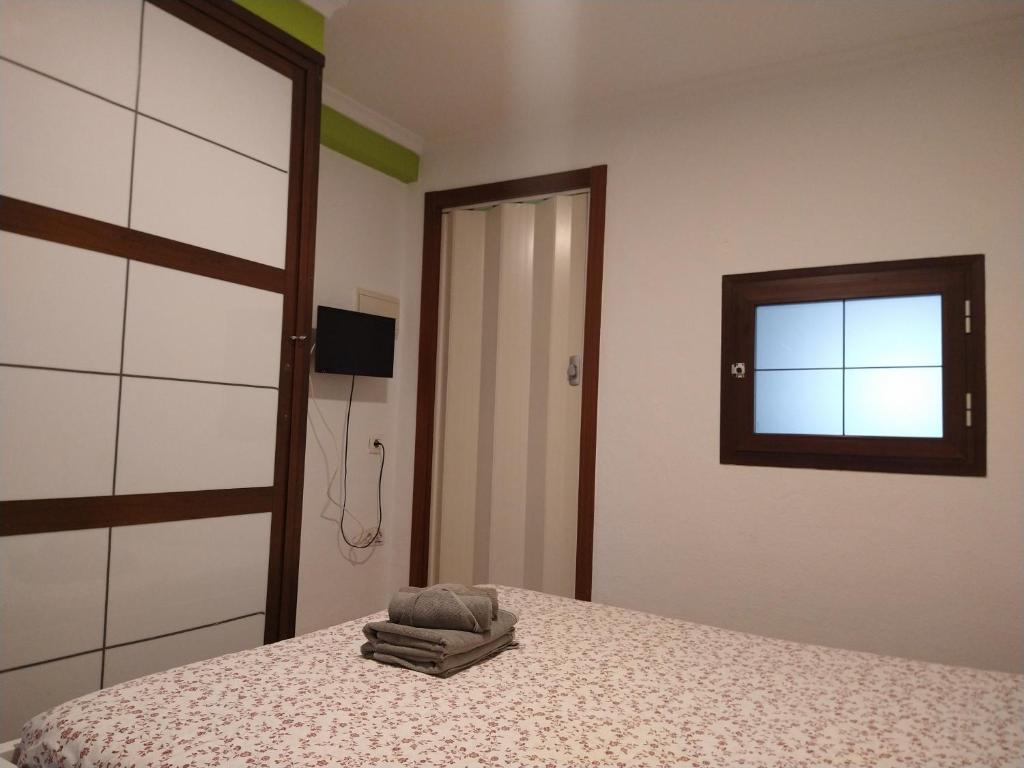 Postel nebo postele na pokoji v ubytování Coqueto miniapartamento junto centro Torremolinos