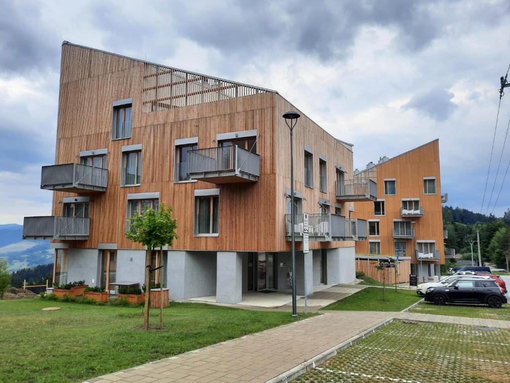 a building with balconies on the side of it at Apartmány Kubínska, Hillside in Dolný Kubín