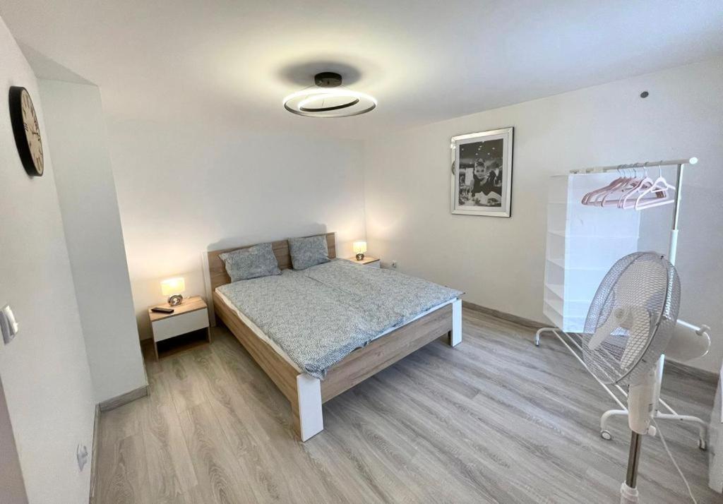 Posteľ alebo postele v izbe v ubytovaní B&J Apartament Międzyzdroje