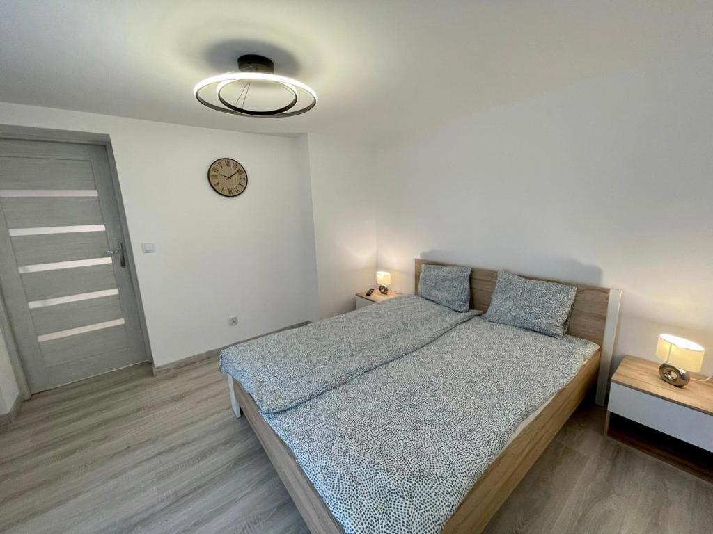 Posteľ alebo postele v izbe v ubytovaní B&J Apartament Międzyzdroje