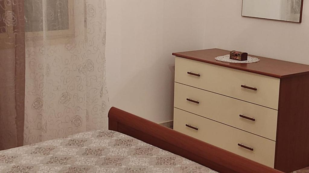 A bed or beds in a room at La Dolce Oasi