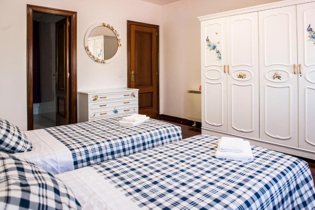 A bed or beds in a room at Las Aceñas De Iris