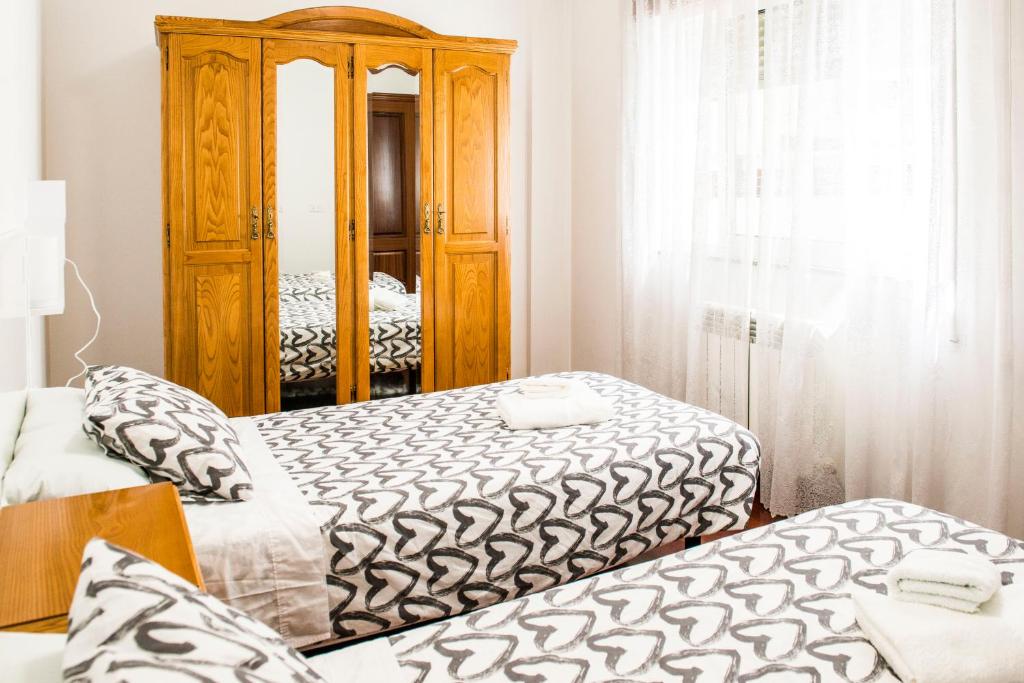A bed or beds in a room at Las Aceñas De Iris