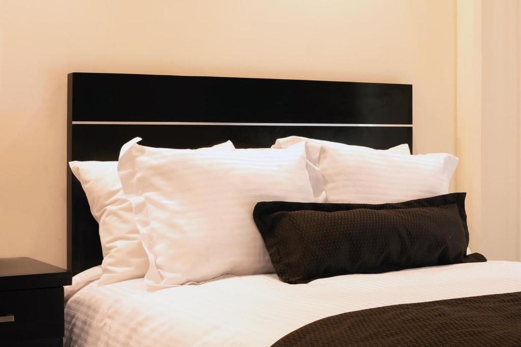 Postel nebo postele na pokoji v ubytování Sendero Hotel