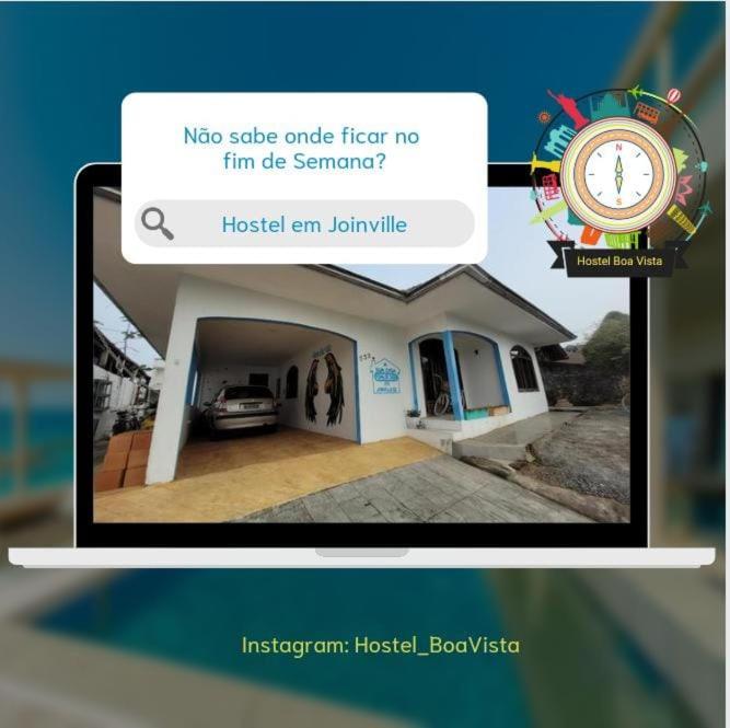 Captura de pantalla de un sitio web de una casa con reloj en Hostel e Pousada Boa Vista, en Joinville