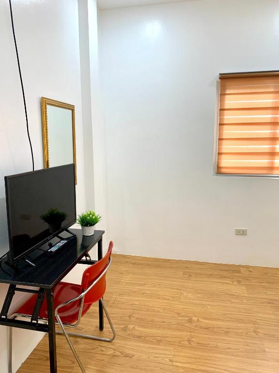 TV a/nebo společenská místnost v ubytování VRT Brilliant Hotel