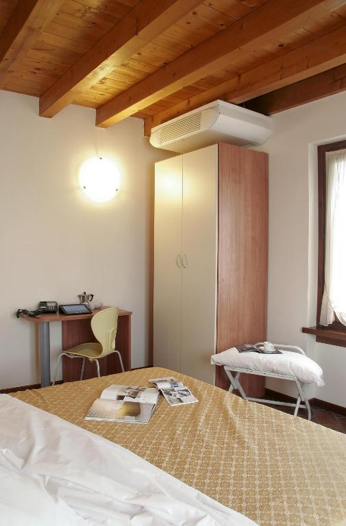 Postel nebo postele na pokoji v ubytování Bed&Wine