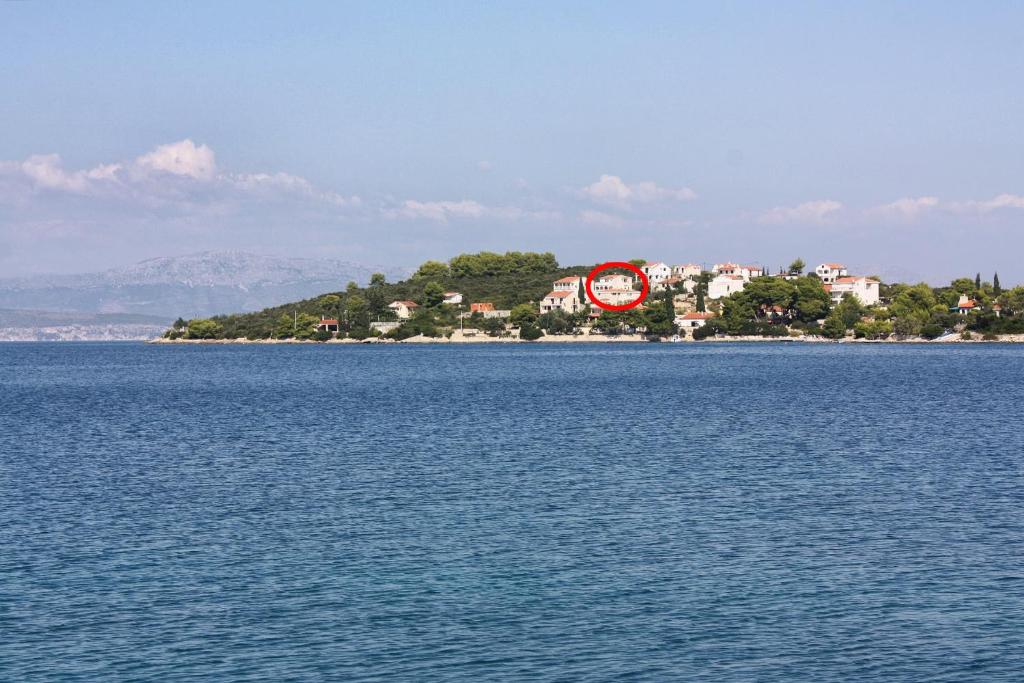 an island in the middle of a large body of water at Apartments by the sea Necujam, Solta - 11090 in Grohote