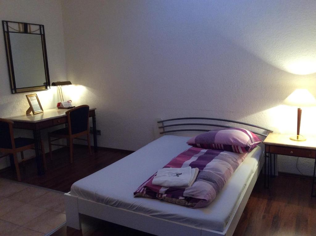 Postel nebo postele na pokoji v ubytování Hotel-12-Apostel