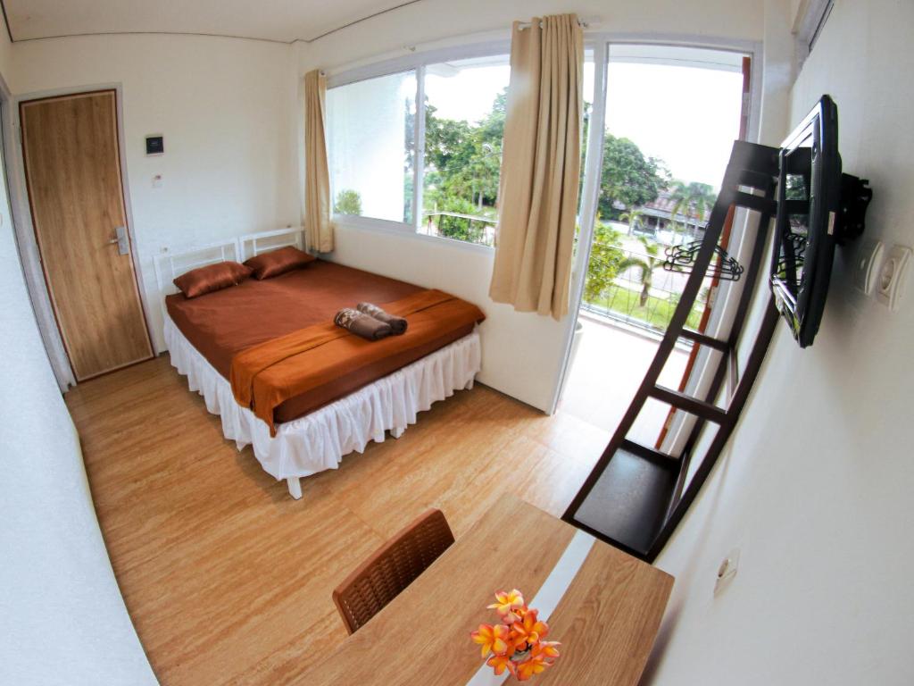Postel nebo postele na pokoji v ubytování Rion Hostel Bogor