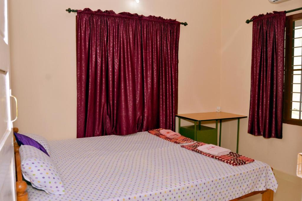 Postel nebo postele na pokoji v ubytování Sheeba's Homestay