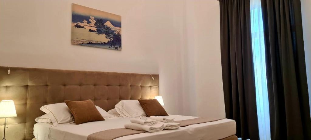 A bed or beds in a room at Home De Curtis