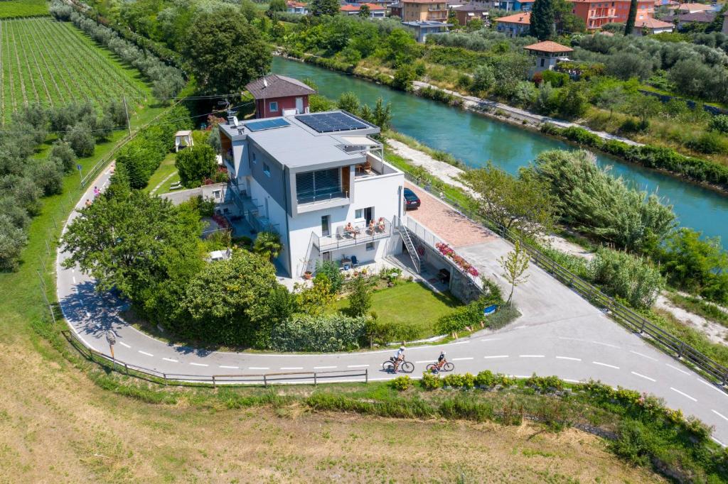 an aerial view of a house next to a river at Appartamenti Villa al Fiume in Nago-Torbole