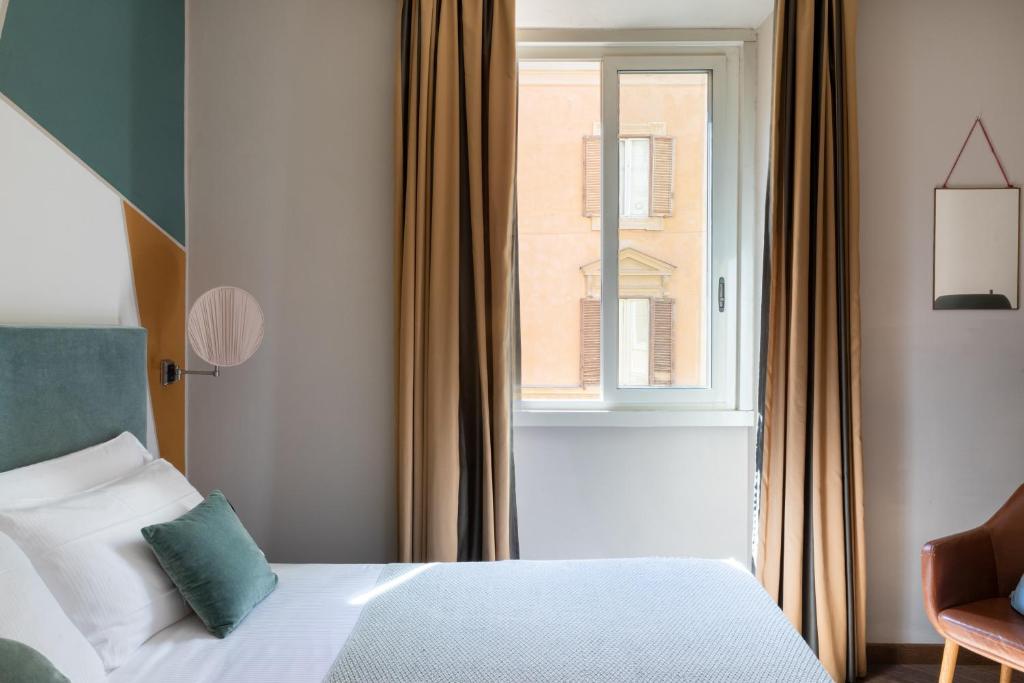A bed or beds in a room at Boutique Hotel Galatea