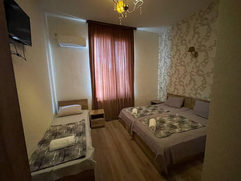 Postel nebo postele na pokoji v ubytování Hotel Alley