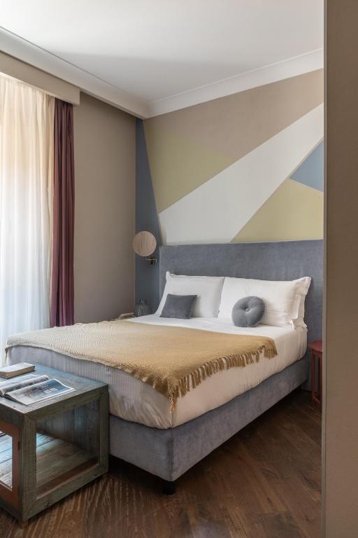 A bed or beds in a room at Boutique Hotel Galatea