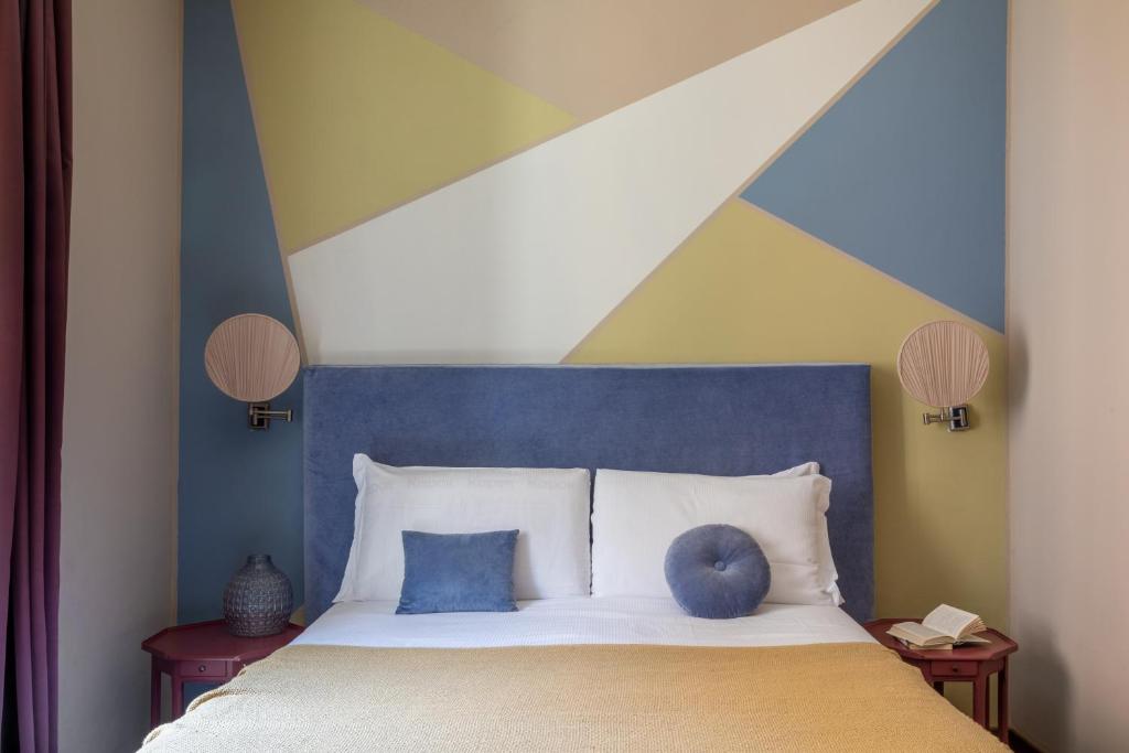A bed or beds in a room at Boutique Hotel Galatea