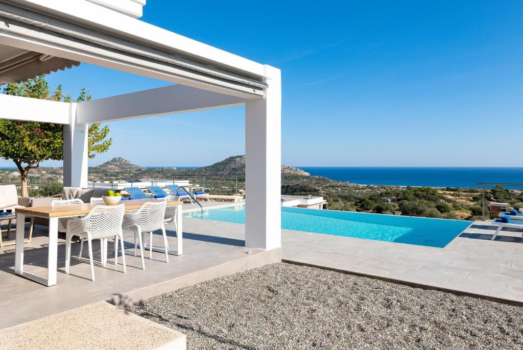 a villa with a view of the ocean at Luxury Villa Hera with Private Pool in Afantou