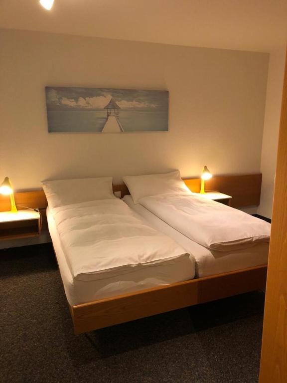 Postel nebo postele na pokoji v ubytování Hôtel Oasis