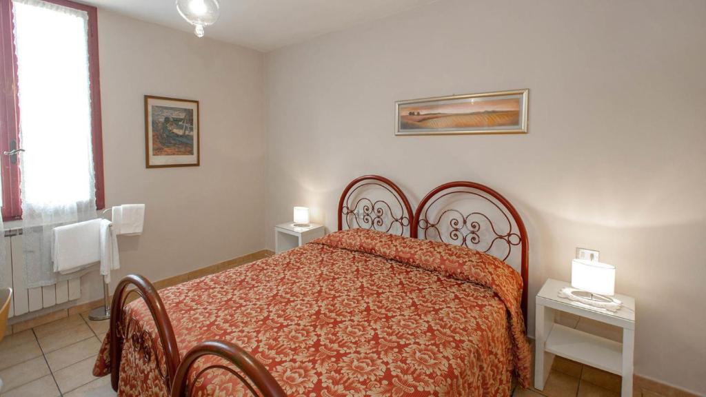 Postel nebo postele na pokoji v ubytování Hotel Masaccio