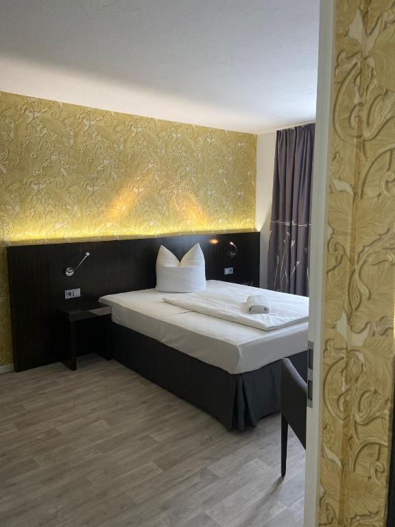 Postel nebo postele na pokoji v ubytování Hotel 22