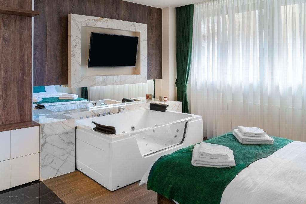 TV i/ili zabavni centar u objektu 9 Nine - Luxury Apartments & Suites