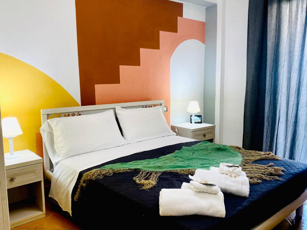 Voodi või voodid majutusasutuse Postino Rooms toas