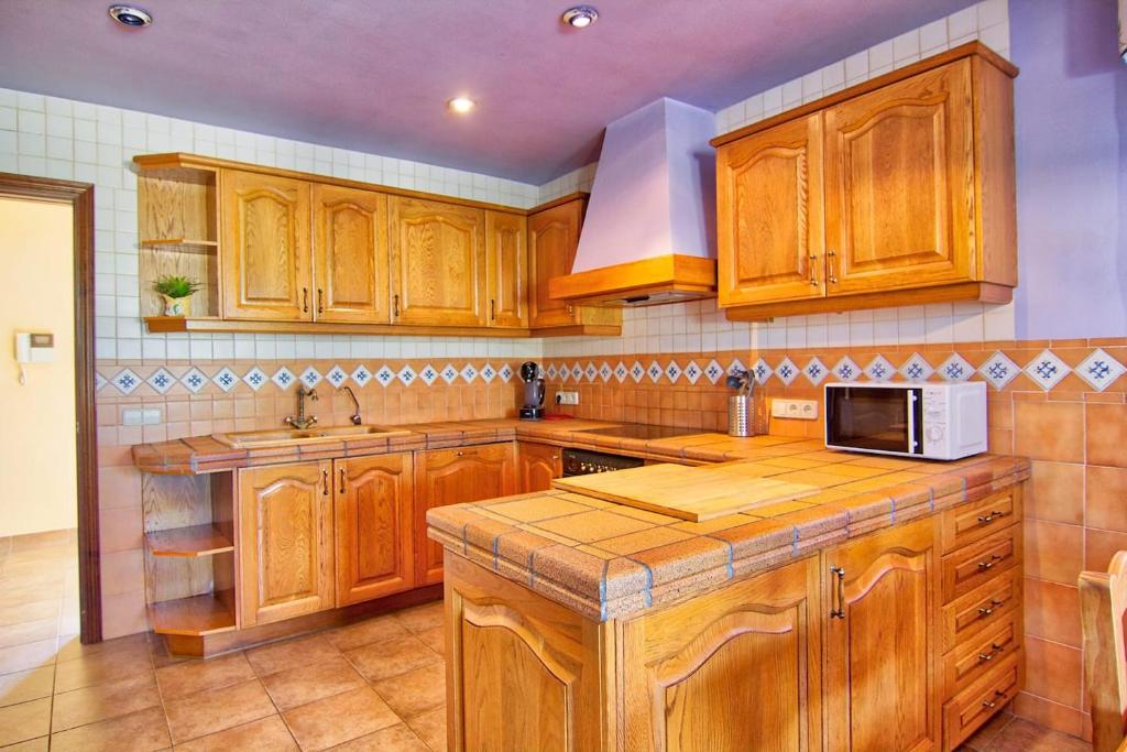 Kuchyň nebo kuchyňský kout v ubytování Villa Los Olivos