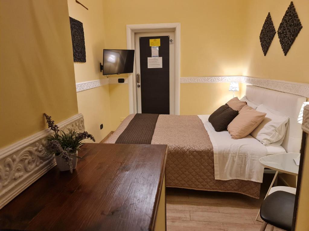 Postel nebo postele na pokoji v ubytování Taras Di San Vito Guest House