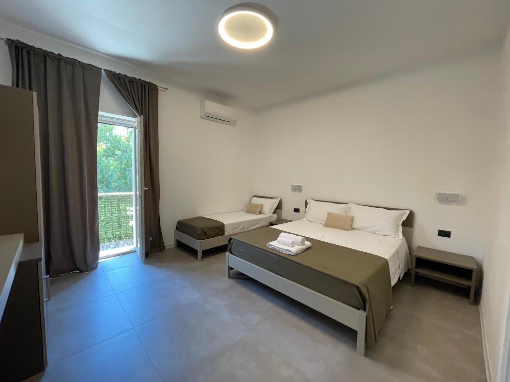 Posteľ alebo postele v izbe v ubytovaní Amaranto Guesthouse