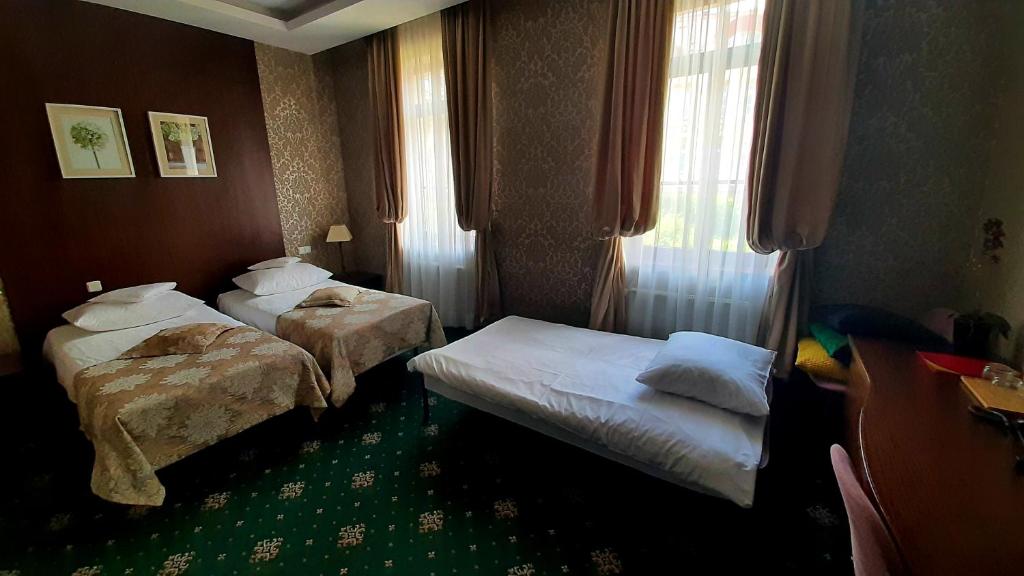 Posteľ alebo postele v izbe v ubytovaní Villa Tradycja