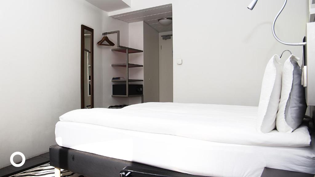 Postel nebo postele na pokoji v ubytování Center Hotels Arnarhvoll