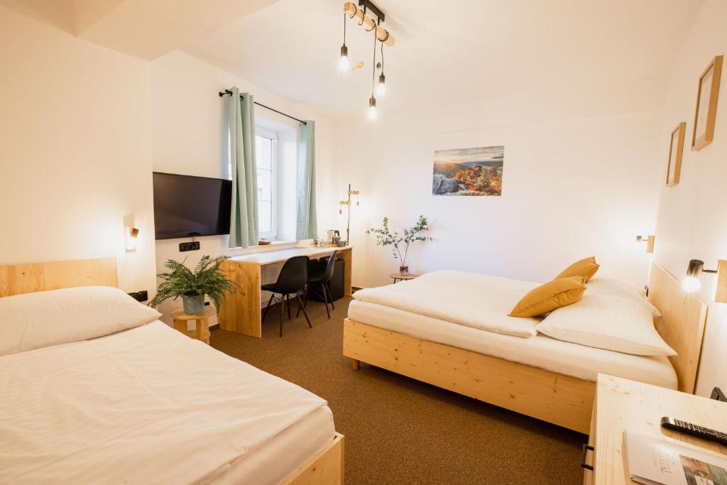 Postel nebo postele na pokoji v ubytování Hotel Rehavital