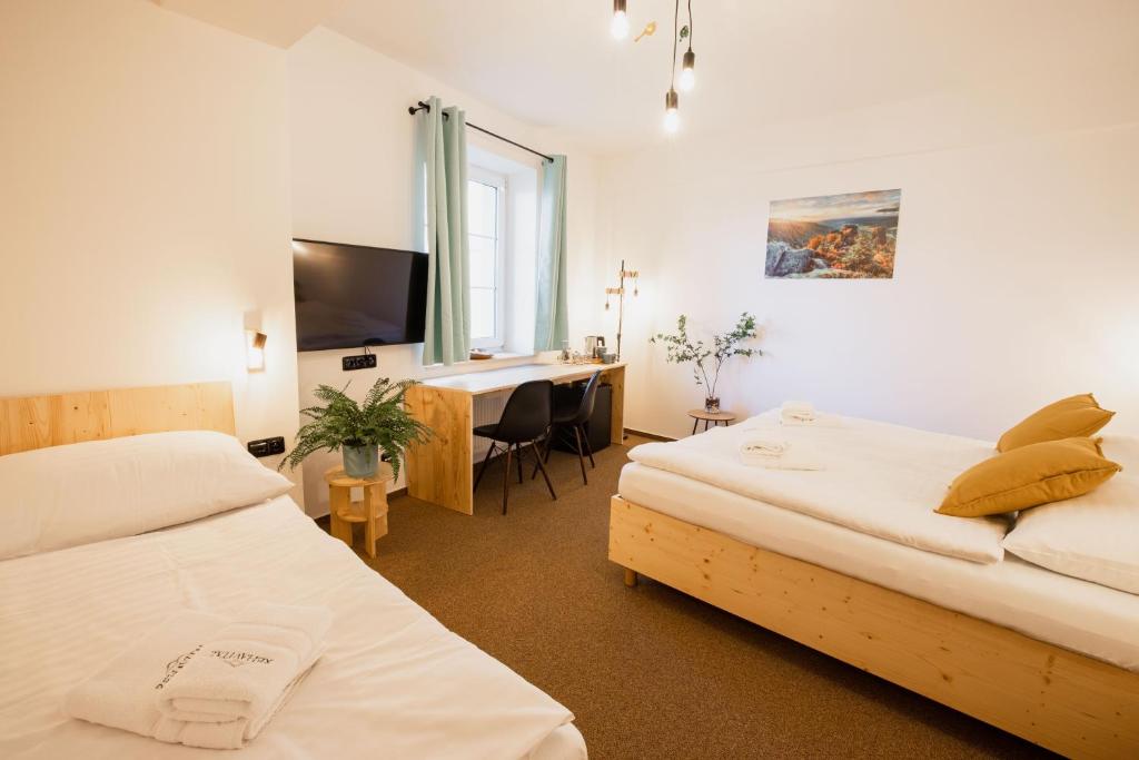 Postel nebo postele na pokoji v ubytování Hotel Rehavital